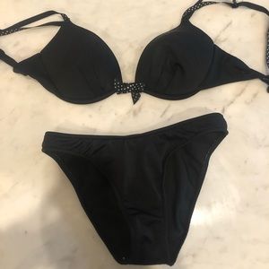 black shaped bikini with polka dot bow